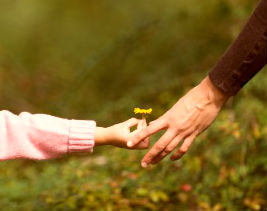 Daughter_with_moms_hand_HERO